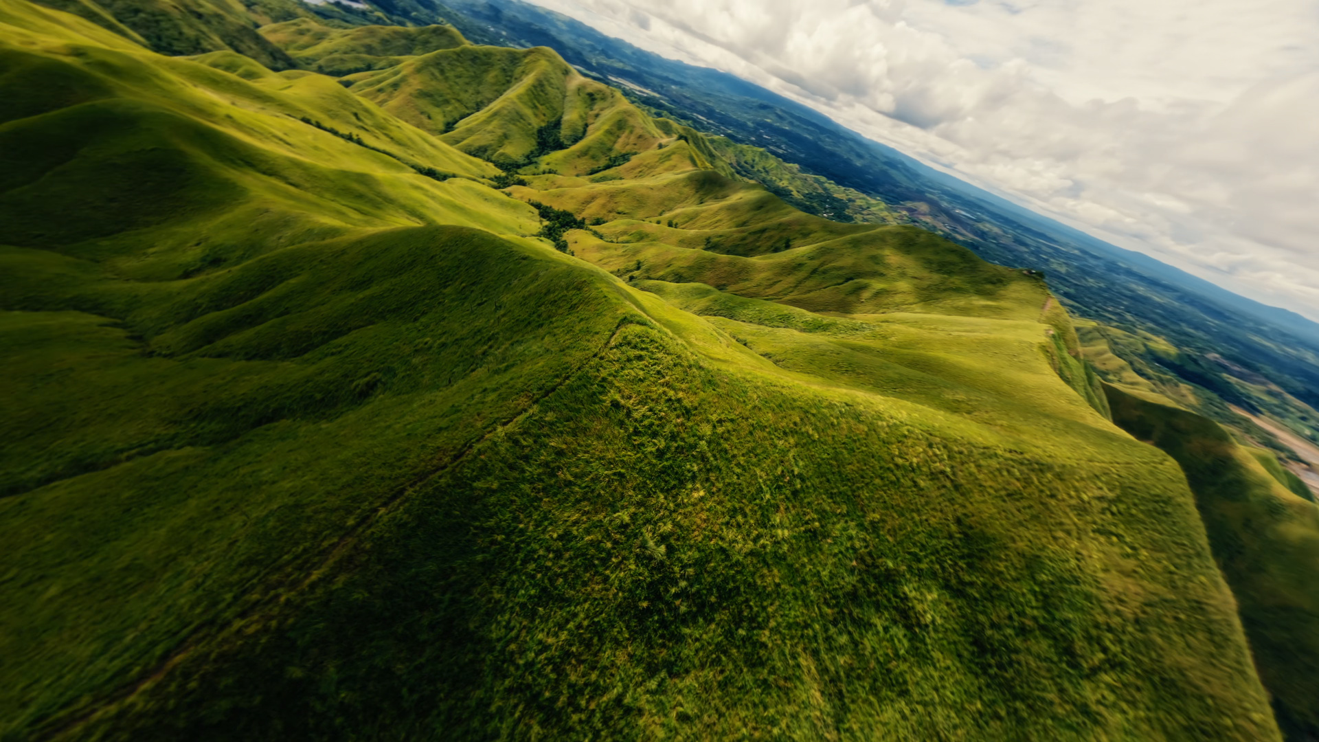 A flowing flight following the contours of green hills.